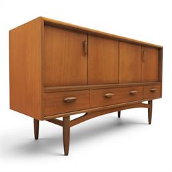 G-Plan - 'Brasilia' teak sideboard, with rectangular top above two concertina doors, above...
