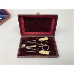 Three sets of sewing implements in fitted cases, to include button hooks and bone handled examples