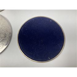 Set of eight silver plated placemats, each of circular form with engraved scroll and floral decoration, including two larger and six smaller examples, largest D23cm, in fitted case 