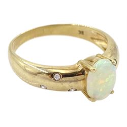 9ct gold opal ring, either side with three rubover set, round brilliant cut diamonds, Sheffield 2004