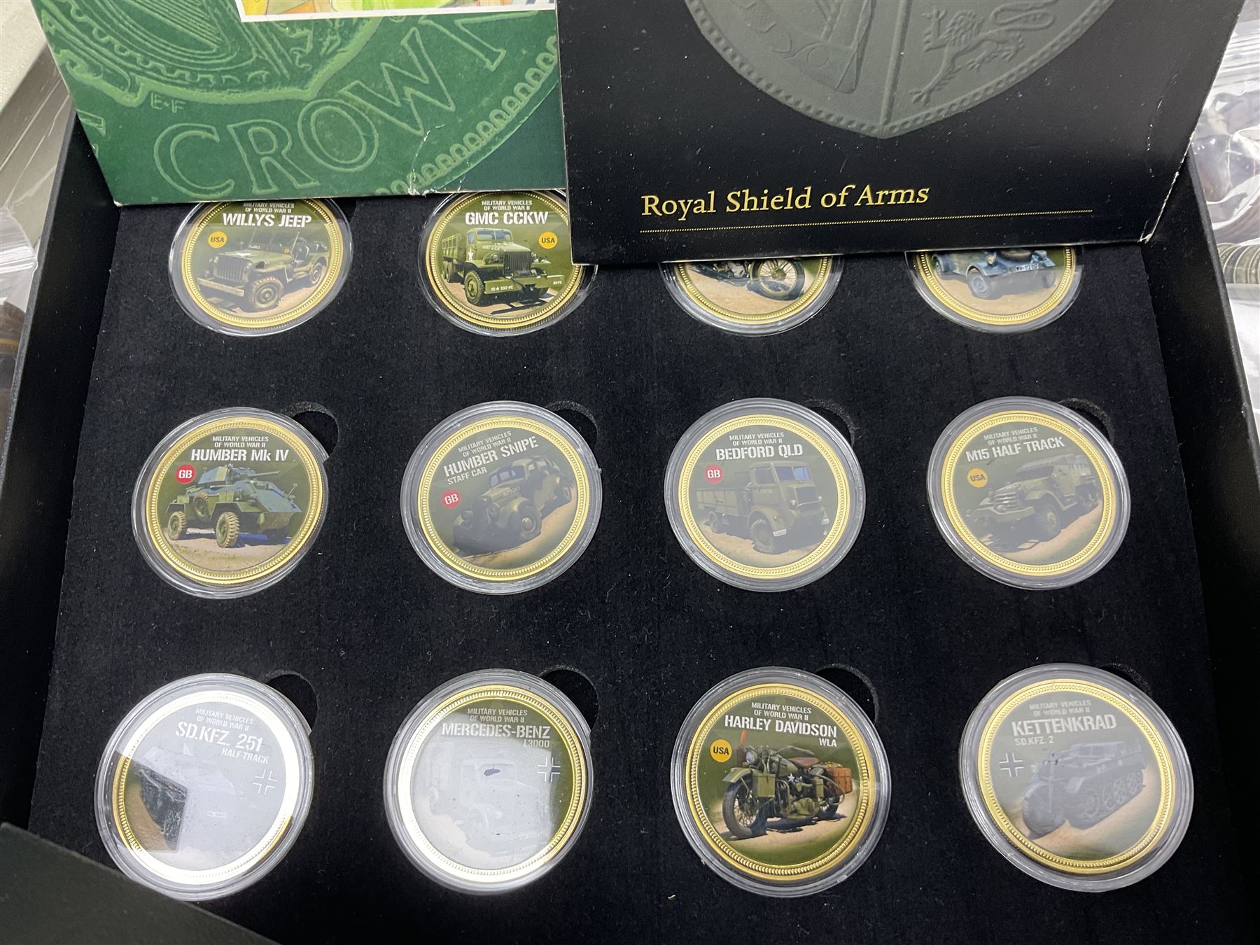 Commemorative and other coinage, including various Queen Elizabeth II 'London 2012 sports collection' fifty pence coins on cards, commemorative crowns, Millennium 2000 'Time Capsule' coin set, channel islands old round one pound coins, part sets etc