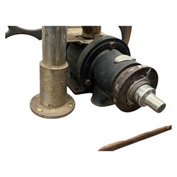 Cabinet with multiple drawers and cupboards mounted with two industrial coffee grinders with large flywheels and brass coffee reservoirs, early 20th century 