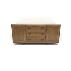 ercol light elm sideboard fitted with three drawers and two cupboards, W156cm, H68cm, D44cm