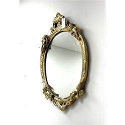 Ornate gilt framed oval mirror