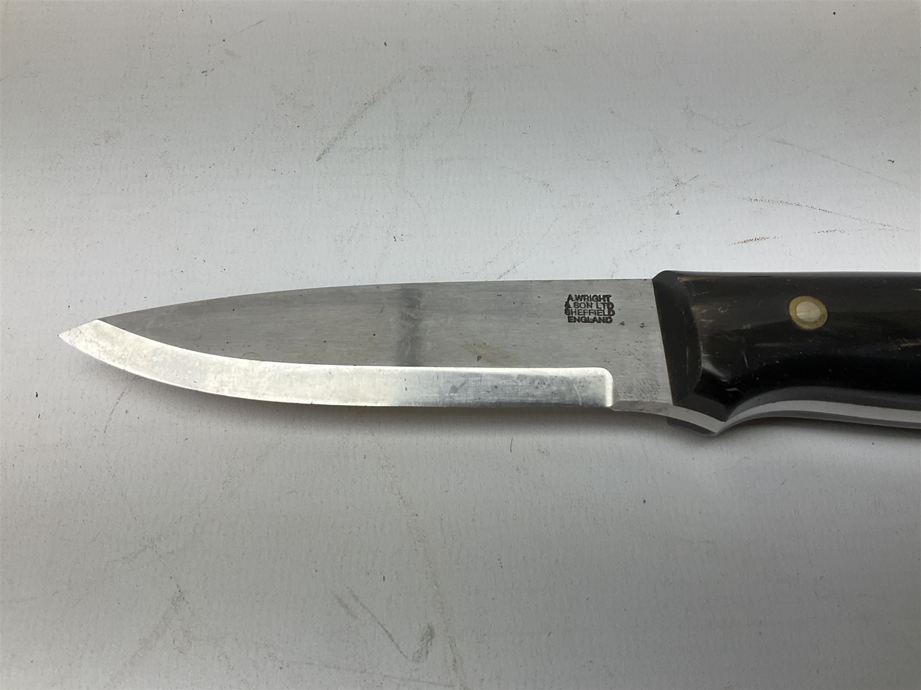 Three hunting knives, each blade marked A. Wright & Sons Sheffield, one with leather handle, one with horn handle and one with antler handle; each with leather sheath (3)