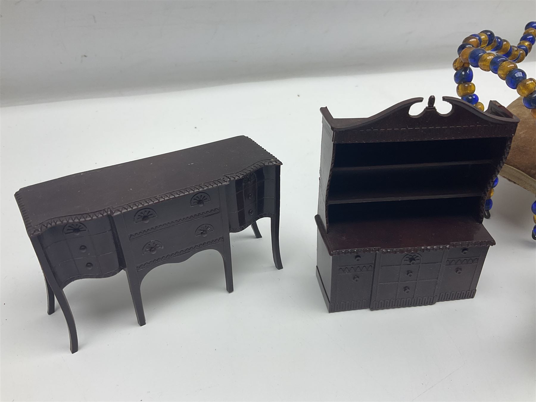 Quantity of early 20th century doll's house furniture comprising Victorian style beadwork and upholstered eight-piece salon suite; beadwork dining table with four matching chairs; and Kleeware brown plastic seven-piece dining suite