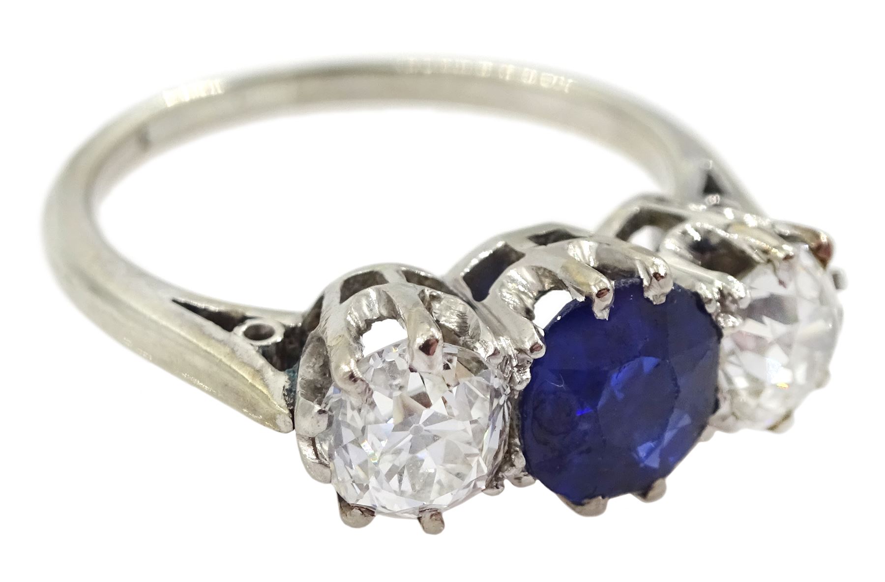 Early 20th century gold three stone old cut diamond and round sapphire ring, sapphire approx 0.60 carat, total diamond weight approx 1.00 carat