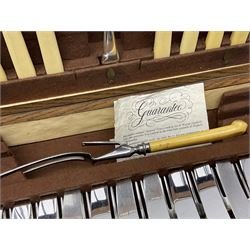 Twelve place setting canteen of cutlery by Lee & Wigfull Ltd, cased in an oak  chest, with key, meat carvers are missing, H18cm, L44cm 