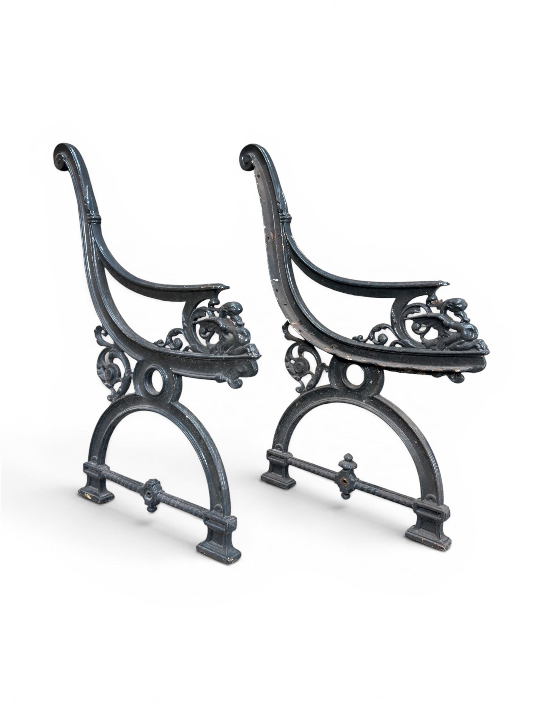 Yates Haywood - pair of 19th century cast iron bench ends, winged griffin detail, arched legs with rope turned decoration, finish in green paint, registration number 206550, first registered 8 March 1867 (see illustration), length as required