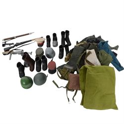 Two 1960s/70s Palitoy Action Man dolls, one with painted hair and one with flocked hair, both dressed in military uniform, together with a collection of mostly Palitoy/Hasbro Action Man clothing and accessories, including Special Operations Kit, Field Radio, weapons, shoes, helmets, clothing and other accessories