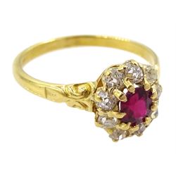 Early 20th century 18ct gold oval cut ruby and old cut diamond cluster ring, stamped, ruby approx 0.45 carat, total diamond weight approx 0.35 carat