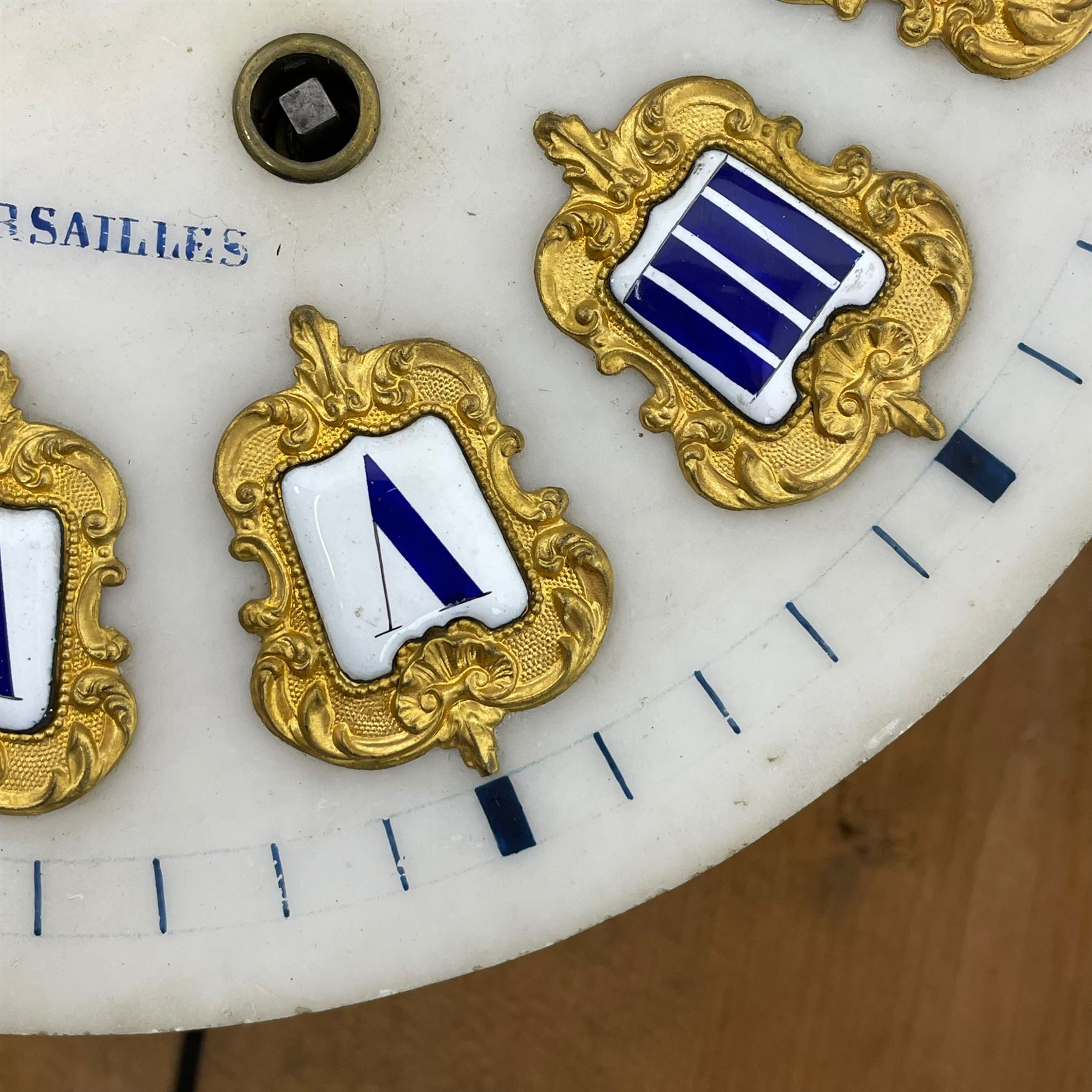 Auguste GP. Andhomme - French vineyard clock,  late 19th century 8-day twin train spring driven wall clock with enamelled and inlaid brass decoration within an ebonised and glazed case, circular enamel dial with cartouche Roman numerals, minute markers, pieced steel hands and a chased brass slip, striking movement, sounding the hours and half hours on a coiled gong. With pendulum and key.  
