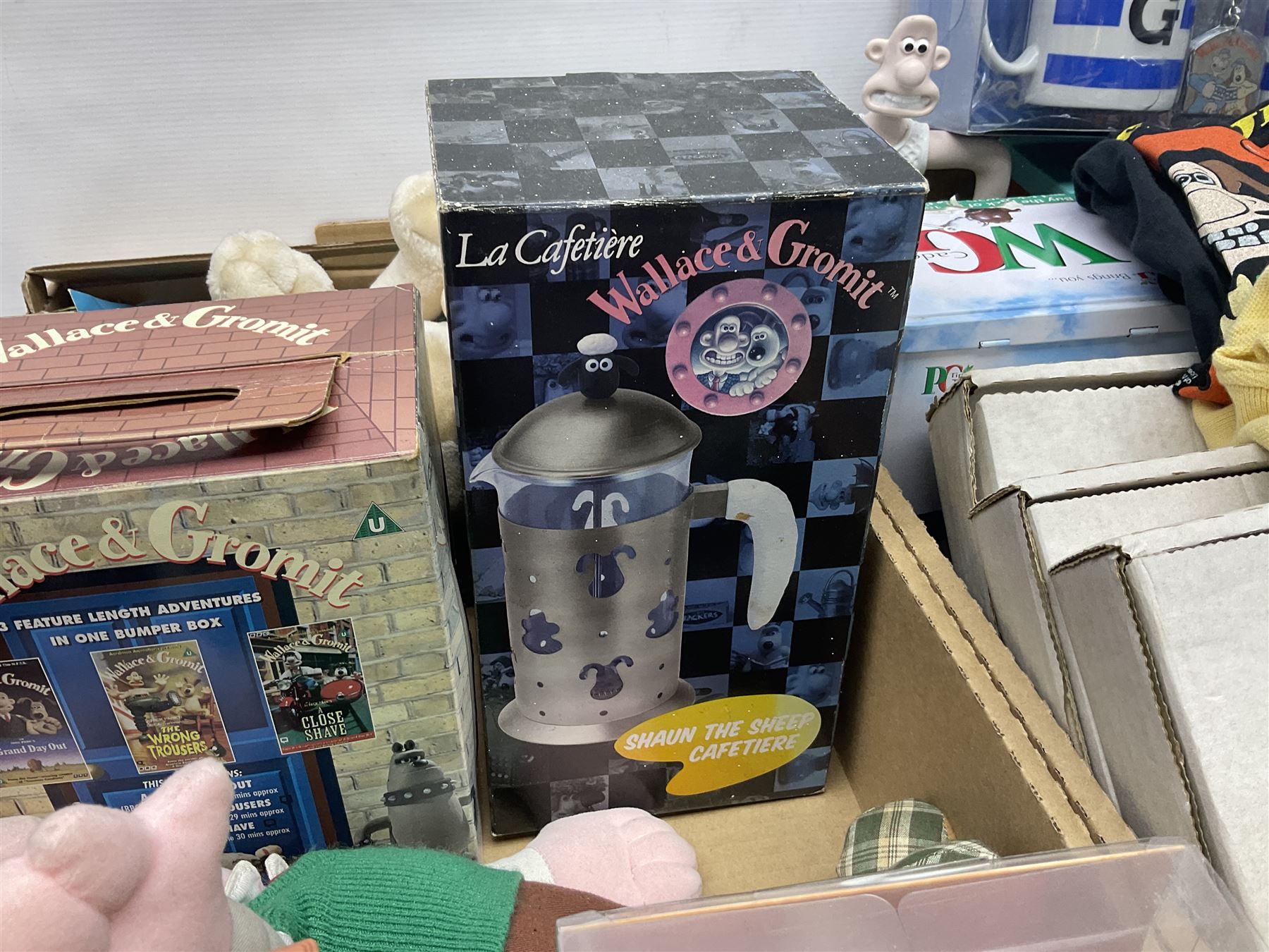 Wallace and Gromit and Shaun the Sheep collectables, including alarm clocks, plates, cafetiere, soft toys, etc, in two boxes