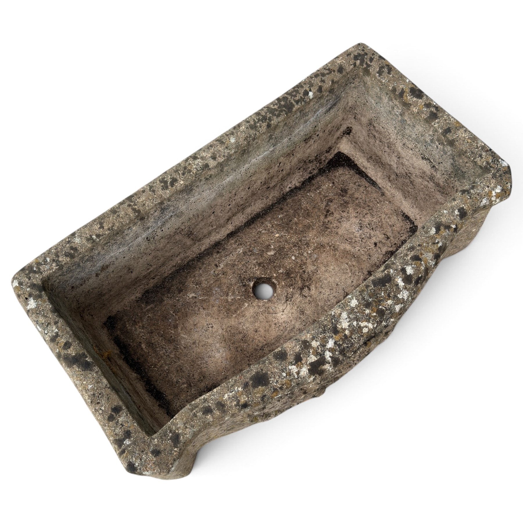 Two weathered composite stone garden trough planters, comprising a low serpentine trough relief moulded with rocaille, shell and foliate ornament (W55cm D32cm H19cm); the plain rectangular trough decorated with four moulded Yorkshire rose medallions to each side (W51cm D26cm H25cm)
