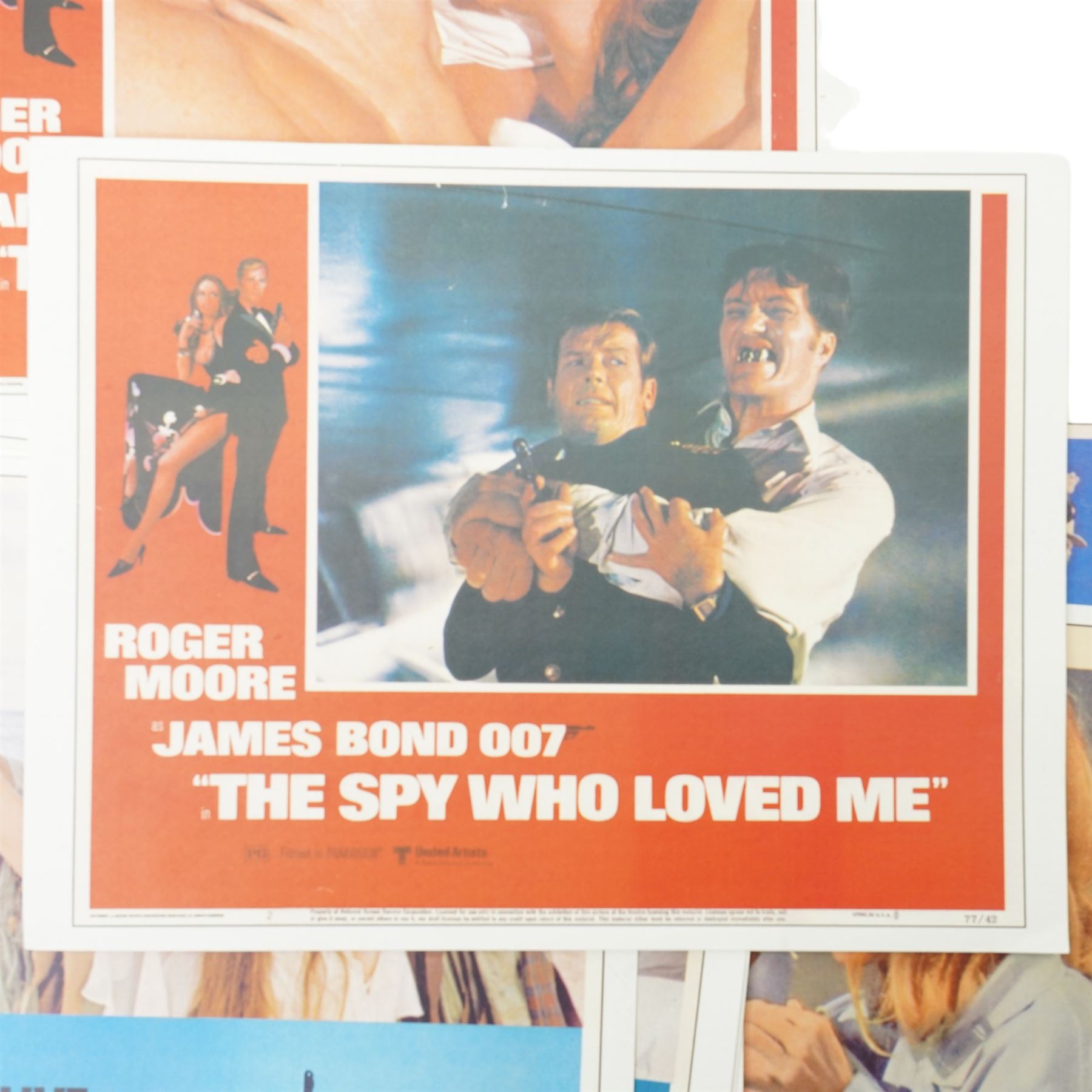  Collection of seventeen James Bond lobby cards starring Sean Connery and Roger Moore including Thunderball, You only Live Twice, Live and Let Die, From Russia with Love etc each 21cm x 27.5cm 