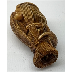 Japanese Meiji carved ivory okimono or seal, modelled as an octopus and fish in a net, with rat seated on top, H5cm   