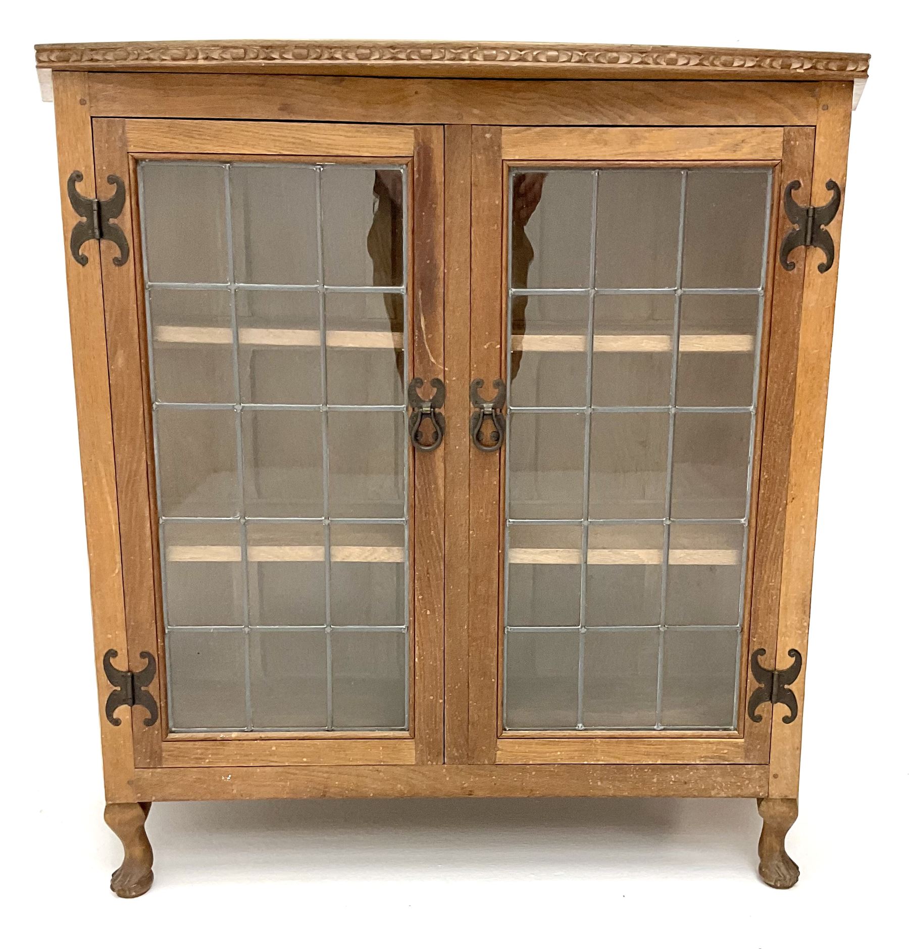 David 'Oakleaf man' Langstaff of Easingwold Yorkshire oak cabinet, egg and dart detailing, with two lead glazed doors enclosing two shelves, bearing oak leaf signature, cabriole claw feet