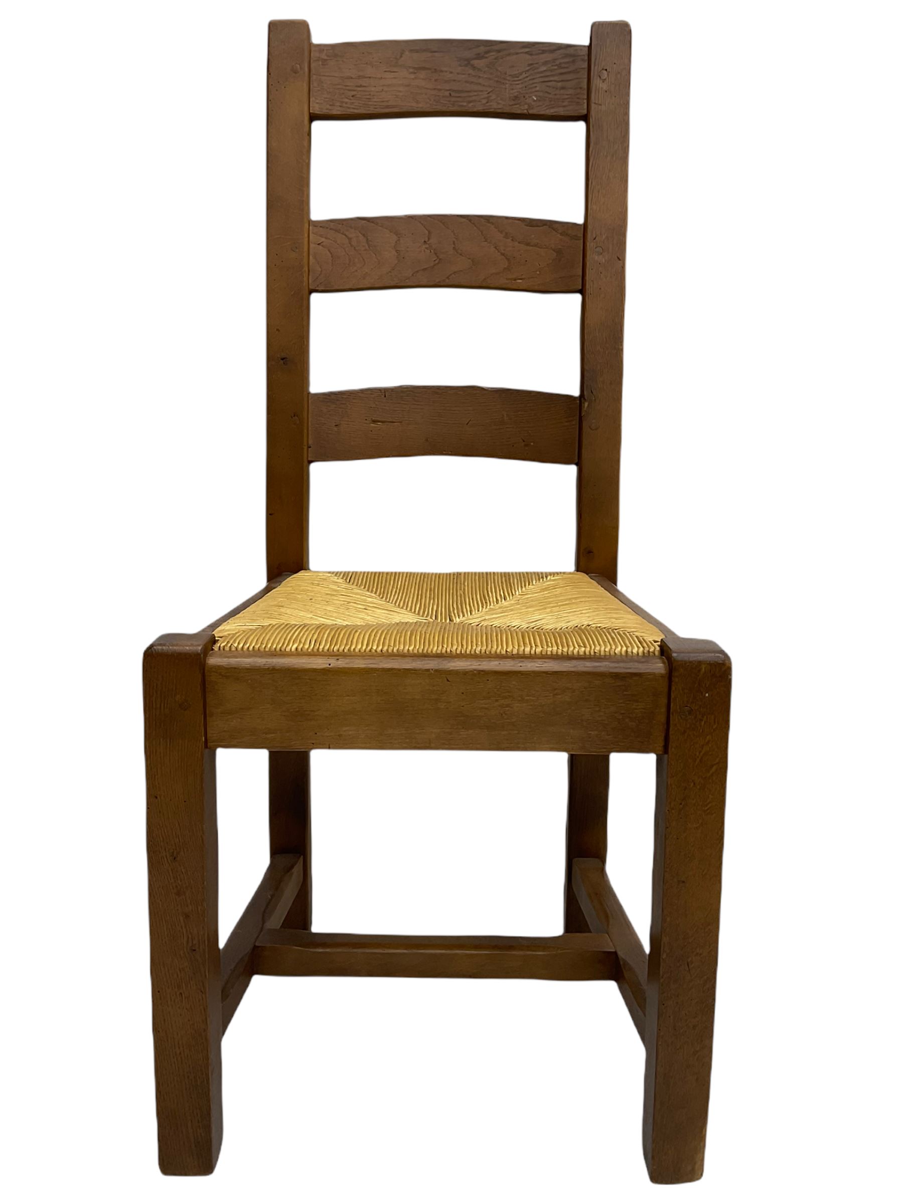 Antix French oak dining table with two leaves, two frieze drawers;, and six ladder back chairs with rush seats