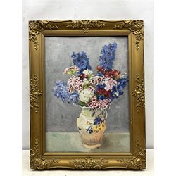 Philip Naviasky (Northern British 1894-1983): Still Life of Flowers in a Vase (recto) and Portrait of a Girl with a Bow in Her Hair (verso), two oils on board painted recto and verso, the former signed in pen 56cm x 41cm