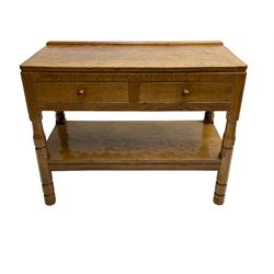 Mouseman - circa. 1950s oak serving table, adzed rectangular top over two drawers, on octagonal supports joined by adzed undertier, the rear right leg carved with mouse signature, by Robert Thompson of Kilburn