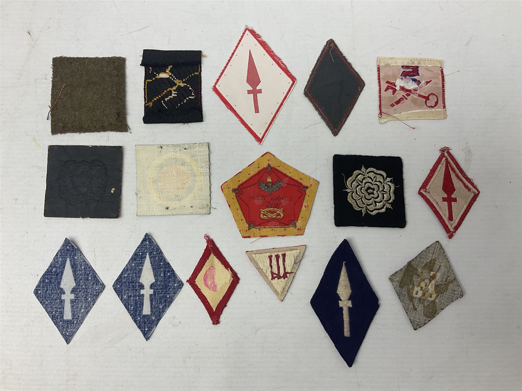 Approximately one-hundred printed and embroidered cloth badges including I, II, VIII, XI, XII and XXX Corps, Eastern Command, various Armoured Divisions, Midland, Wessex, Home Counties and 12th Infantry Brigades, Salisbury Plain, Northumberland, Hampshire, North Midland, West Riding, Essex and Suffolk Districts, Berlin & Rhine Army Troops etc