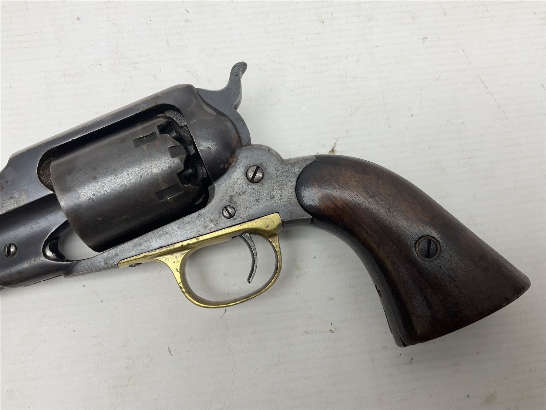 Unmarked Spencer & Rogers type Remington style .44 cal. six-shot percussion revolver, 20cm octagonal barrel with loading lever under, brass trigger guard and two-piece wooden grip L37cm overall; together with a framed watercolour by Alan J. Gray dated 2009 entitled 'The Remington .44 Calibre 1861 Navy Revolver'  19 x 42cm (2)