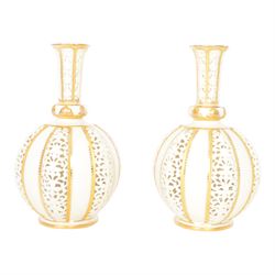 Pair of Grainger & Co. Royal China Works Worcester vases, of globular form with knopped elongated neck, with alternating reticulated panels  and gilt highlights, with printed mark beneath each numbered 1963, H19cm