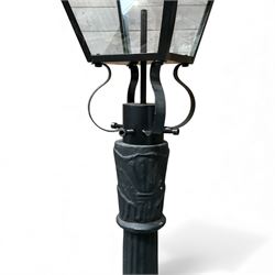 Victorian-style cast iron lamp post in a black finish,