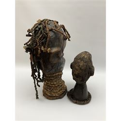 Two carved African heads, comprising one with plaited detail to neck and hair, H38cm, and another smaller example with twisted detail to base