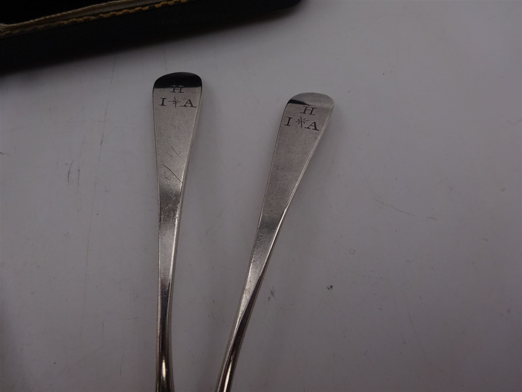 1920s silver cigarette case, of typical form, with engraved lozange to cover, hallmarked Charles Edwin Turner, Birmingham 1920, together with a pair of George III silver Old English pattern teaspoons, with engraved initials to terminal, hallmarked Peter, Ann & William Bateman, London 1803 and a cased spoon and pusher, hallmarked 