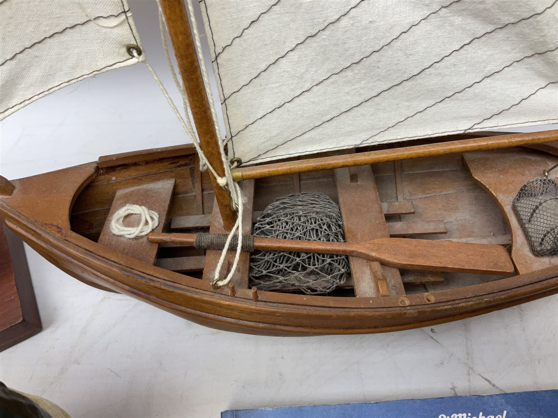 Nautical themed decorative items, to include Titanic book ends, model boat, books, lighthouse lamp etc in one box