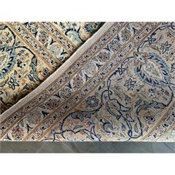 Fine Persian Kashan carpet, ivory ground with overall interlacing and scrolling foliate design, decorated all over with stylised flower heads, repeating guarded border