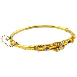 Early 20th century 15ct gold sapphire and split pearl hinged bangle, stamped 15ct
