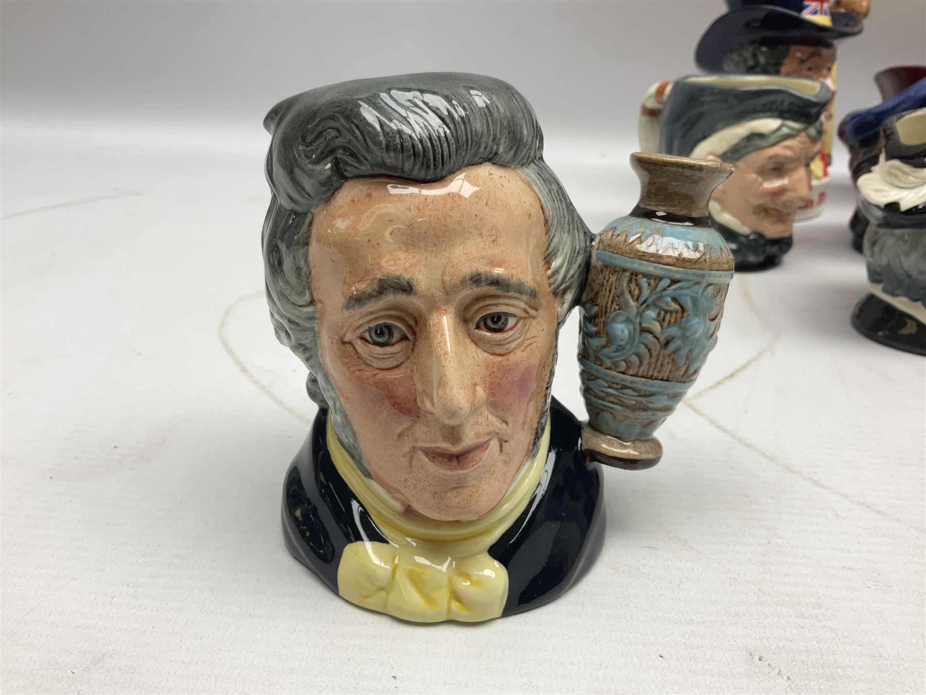 Large collection of Royal Doulton miniature character jugs, to include The Postman D6801, The London 'Bobby' D6762, Old Salt, D6554, Sir Henry Doulton D6703 etc  
