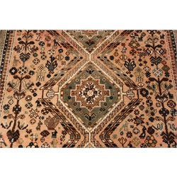 Persian style brown ground rug, three central medallions (300cm x 207cm) and a Persian style red ground rug (200cm x 135cm)  