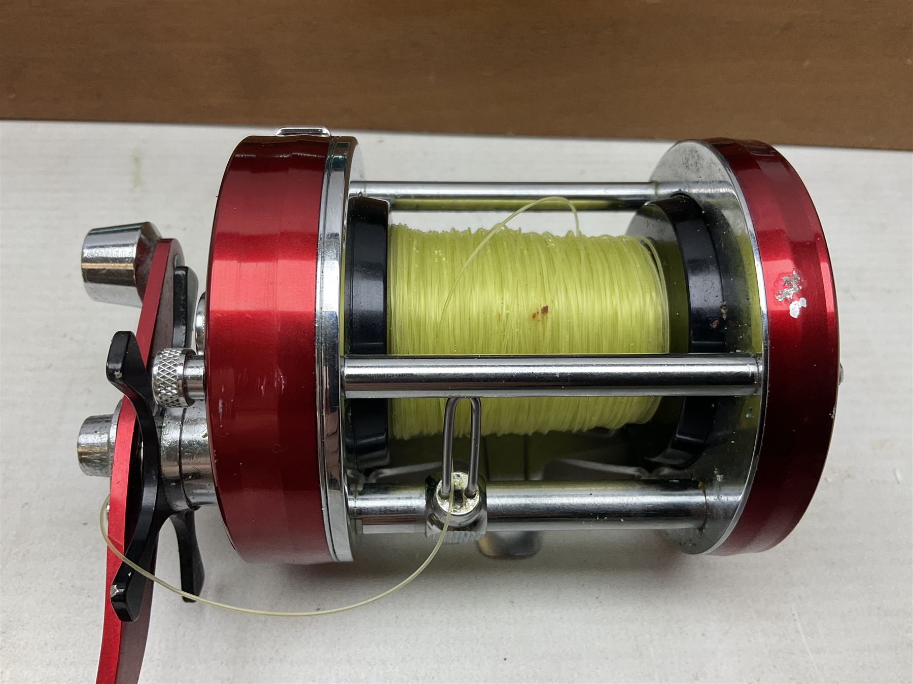 Four Abu fishing reels, comprising Ambassadeur 9000, Ambassadeur 7000, Ambassadeur 5500 and Ambassadeur 6500, together with additional line, hardy fishing bag and two wooden boxes