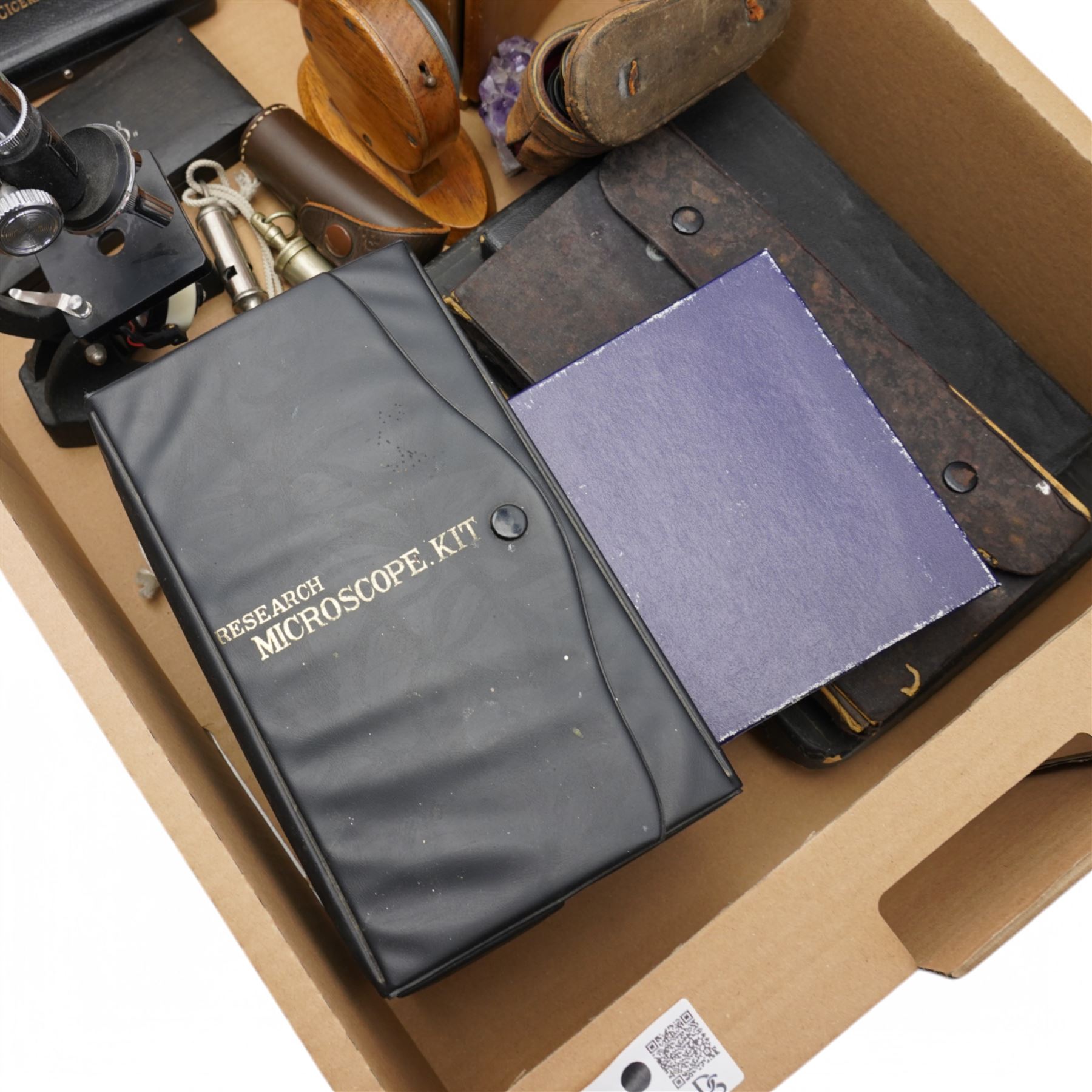 Aircraft clock in oak case, two microscopes and slides, opera glasses, two micrometers, cases of drawing instruments, box of named semi precious stone eggs etc