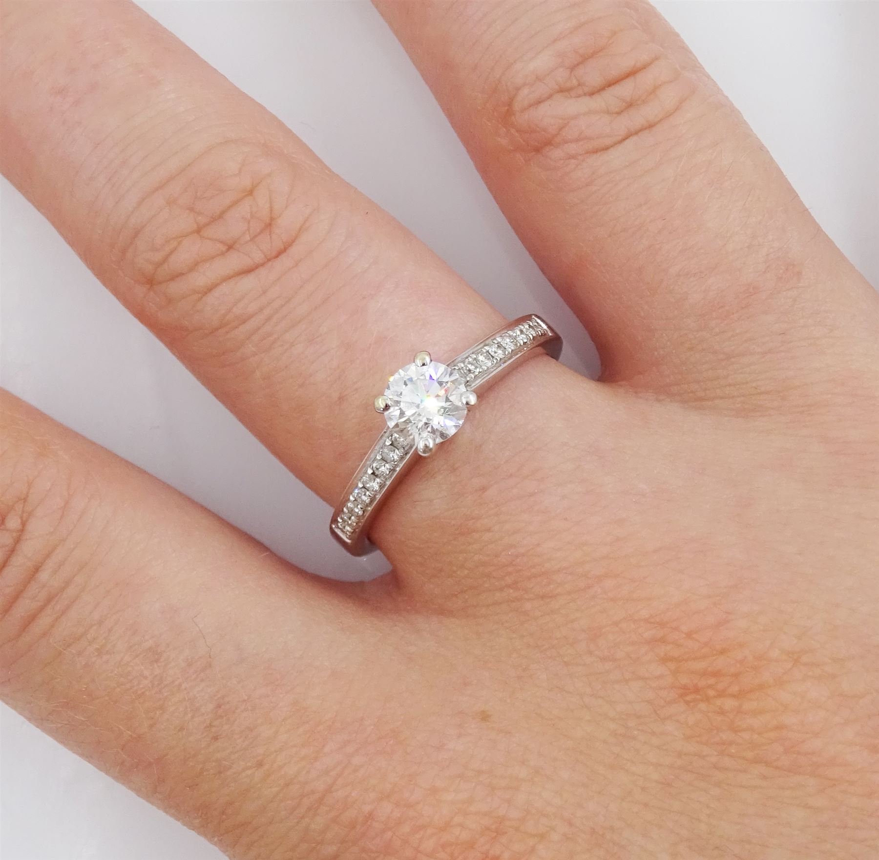 18ct white gold single stone round brilliant cut diamond ring, with diamond set shoulders, stamped 750, principal diamond 0.53 carat, diamond colour D, clarity VVS2, with GIA report