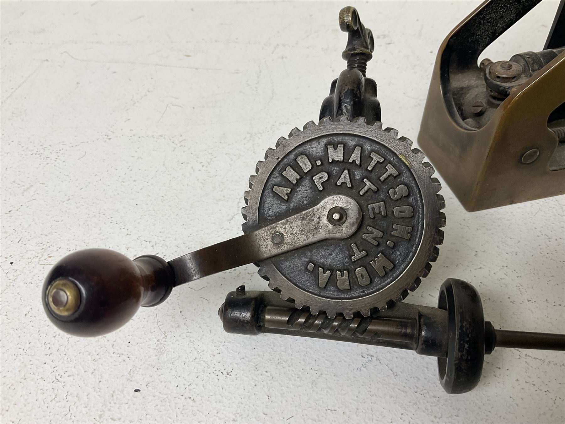 Cambridge Scientific Instruments Co clinometer, flintlock tinder lighter, and a Anders Mattson Mora patent bobbin winder (3)