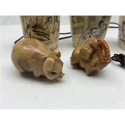 Three bone oriental scent bottles with erotic scenes, together with netsukes and similar items 
