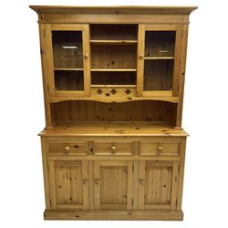 Traditional pine dresser, the rack fitted with two shelves flanked by glazed cupboards, the base with three drawers over three panelled cupboards