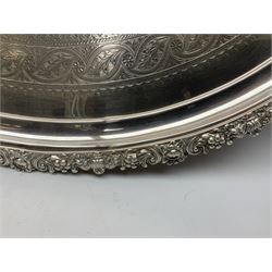 Large Victorian silver plated twin handled serving tray, of oval form with foliate and acanthus cast rim, the centre chased with a monogramed cartouche within a foliate surround and foliate border, upon four bracket feet, makers mark worn and indistinct, including handles L79cm