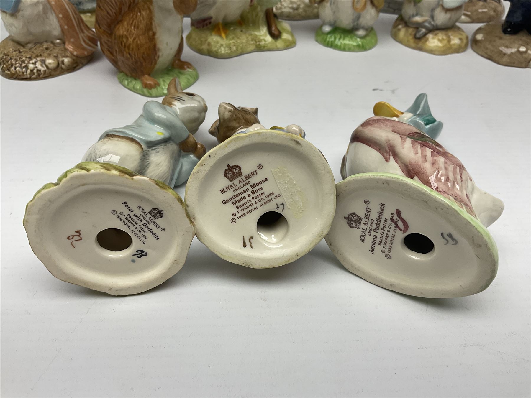 Sixteen Royal Albert Beatrix Potter figures, including Poorly Peter Rabbit, Jemima Puddle Duck and Squirrel Nutkin etc, all boxed together with a Beswick Beatrix Potter Jeremy Fisher miniature jug and four Beswick Wind in the Willows figures 