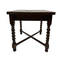Early 20th century oak barley twist extending table, two fold-over leaves with pull-out stays, spiral turned supports joined by x-stretchers