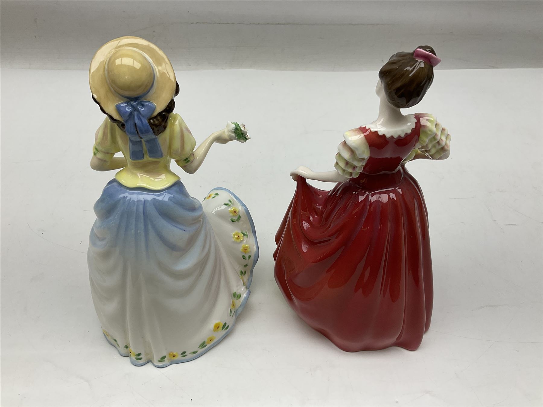 Five Royal Doulton figures, comprising Flower of Love HN3970, Emily HN3688, Southern Belle HN2229, Helen HN3886 and My Love HN2339, all with printed mark beneath, some with boxes, together with a Royal Doulton Figures reference book by D Eyles and R Dennis