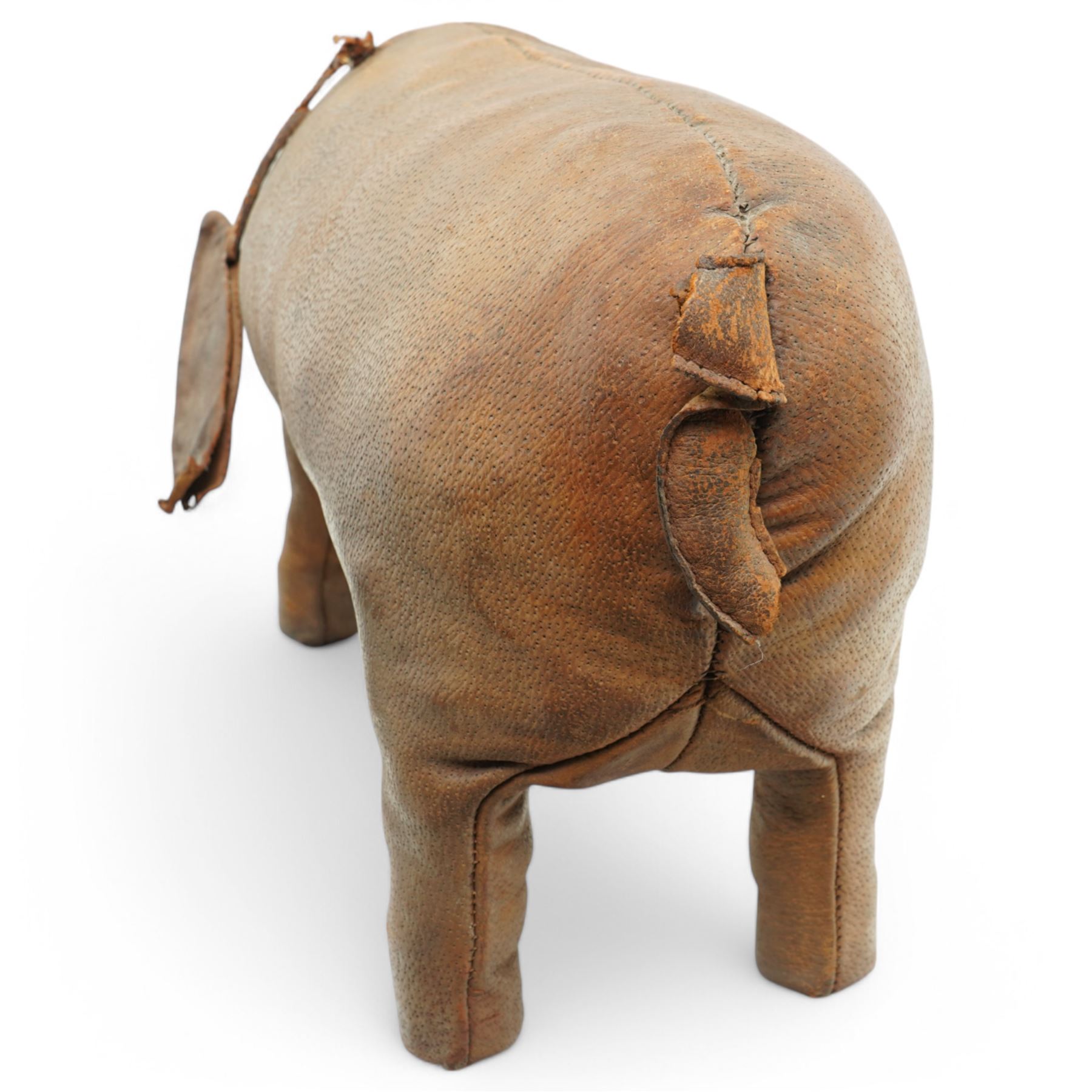 Dimitri Omersa (1927-1975) for Liberty's of London, two mid-20th century brown leather footstools, in the form of a pig and piglet, larger pig bearing Liberty stamp beneath ear, pig W86cm, piglet W49cm