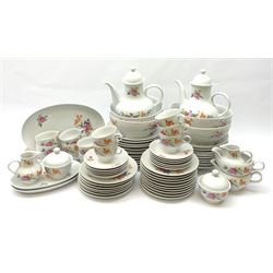JLmenau German tea and dinner wares, comprising twelve dinner plates, seventeen side plates, twelve bowls, four large serving bowls, pair of oval serving platters, pair of smaller examples, two coffee pots, eleven teacups, twelve saucers, two milk jugs, two larger jugs, and two lidded sucriers. 