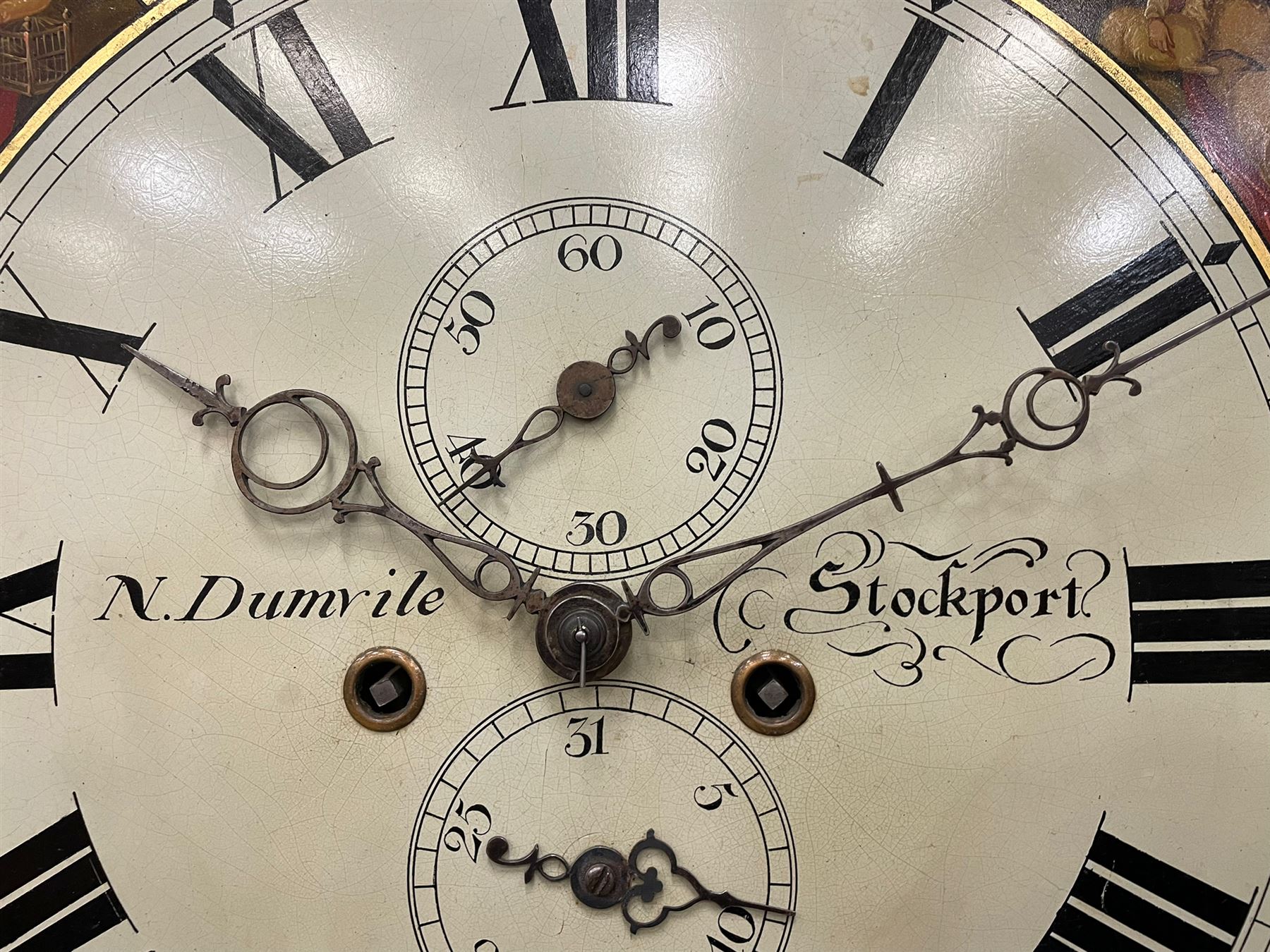 Nathaniel Dumville of Stockport - 8-day brass inlaid mahogany longcase clock c1840, swans neck pediment with ball and spire finials and wooden paterae, recessed break arch hood door flanked by rope twist pilasters, trunk with conforming pilasters and gothic ogee topped door, canted plinth raised on bracket feet, fully painted break arch dial with moon work and spandrels depicting the four seasons, centre with Roman numerals, minute track, subsidiary date and seconds dials, matching stamped brass hands, four pillar movement with an anchor escapement, rack striking on a bell. With weights and pendulum.
The Dumville family were prevalent Cheshire clockmakers working in Stockport 1820-42.
