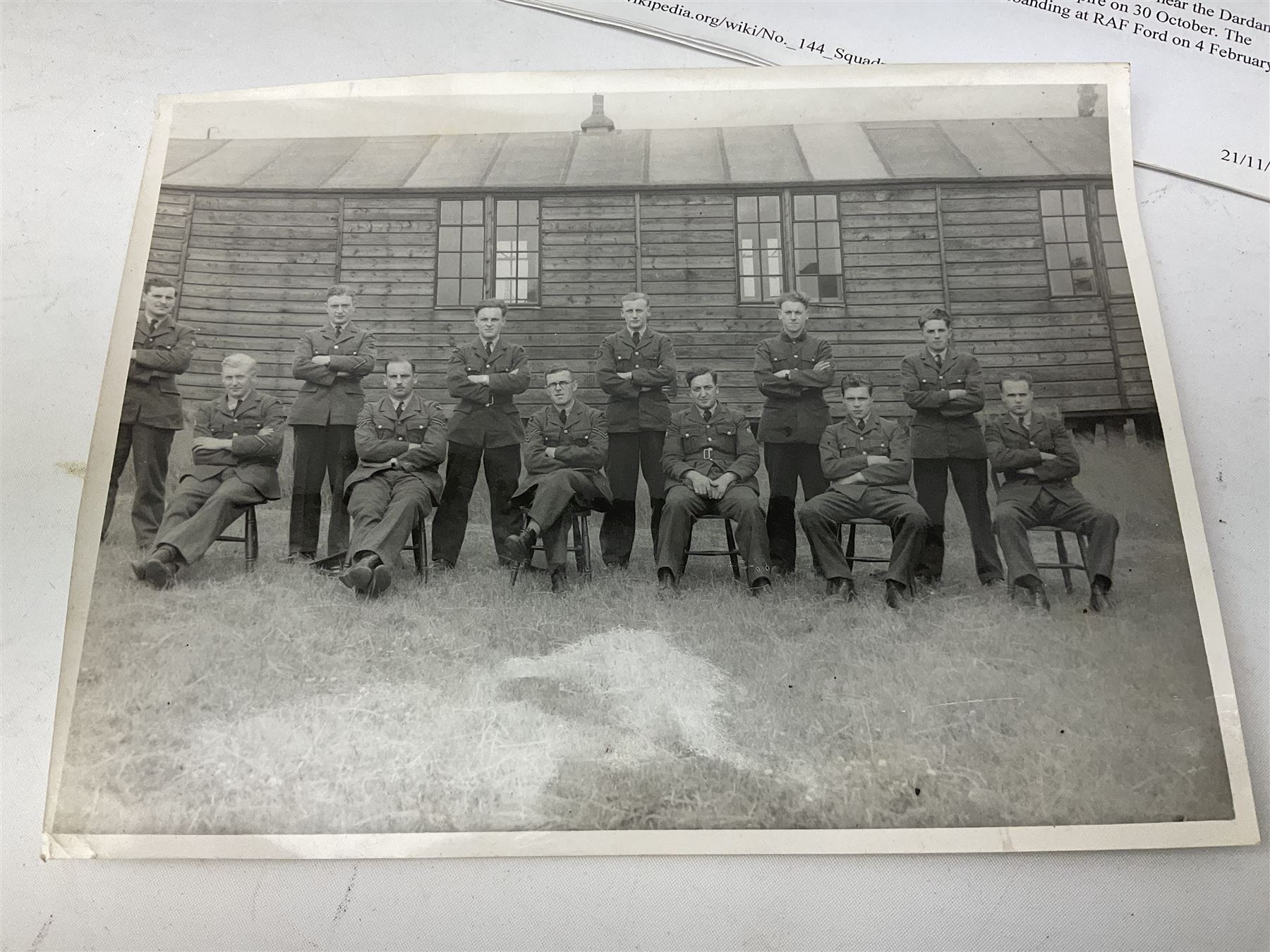 144 Squadron RAF - album containing over one hundred photographs and postcards of varying sizes including group shots, aircraft on the ground and in the air, German aircraft, crashes etc; sizes from 3.5 x 6cm to 16 x 21cm; and quantity of modern reference material
