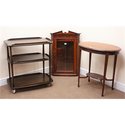  Ercol elm three tier tea trolley (W71cm, H71cm, D46cm) an oval two tier mahogany occasional table (W69cm, H71cm, D46cm) and a wall hanging corner cupboard (3)  